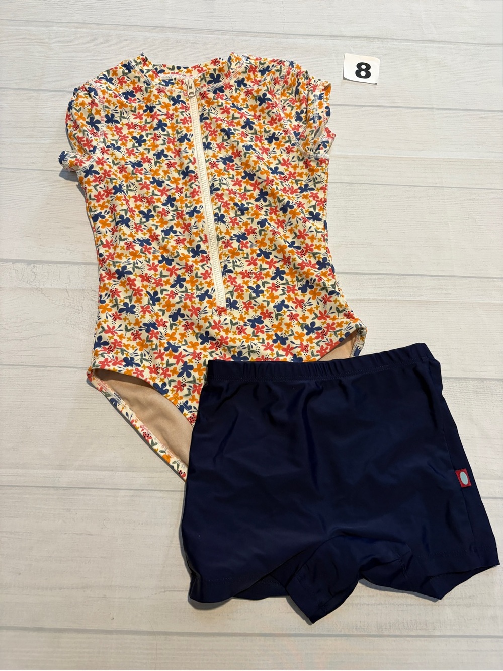 Tea Collection Cream Floral Zip One-Piece with Navy Swim Shorts